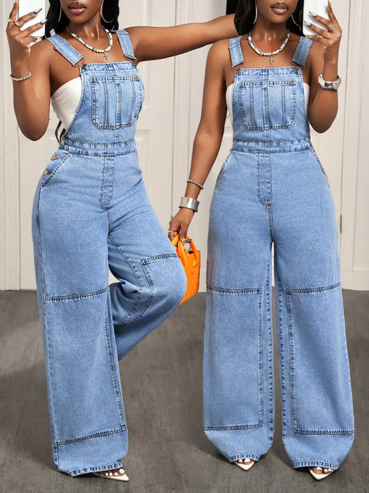 Woman wearing light blue wide leg denim overalls with adjustable straps.